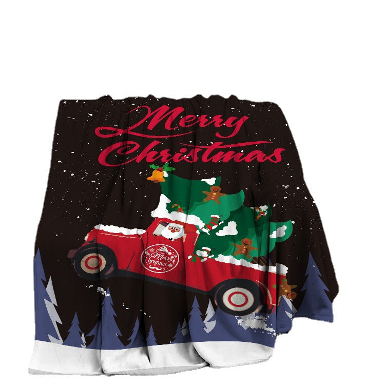 Soft fleece Christmas throw with a festive print, draped over a sofa - black red pick-up