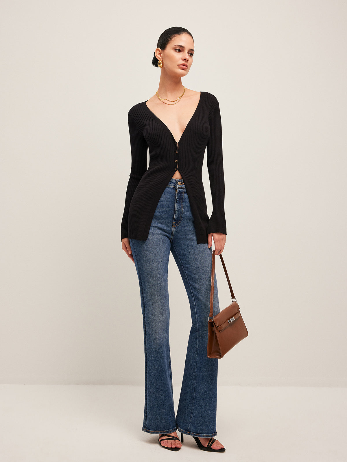 Women's fitted ribbed cardigan with a deep V-neck and split front hem