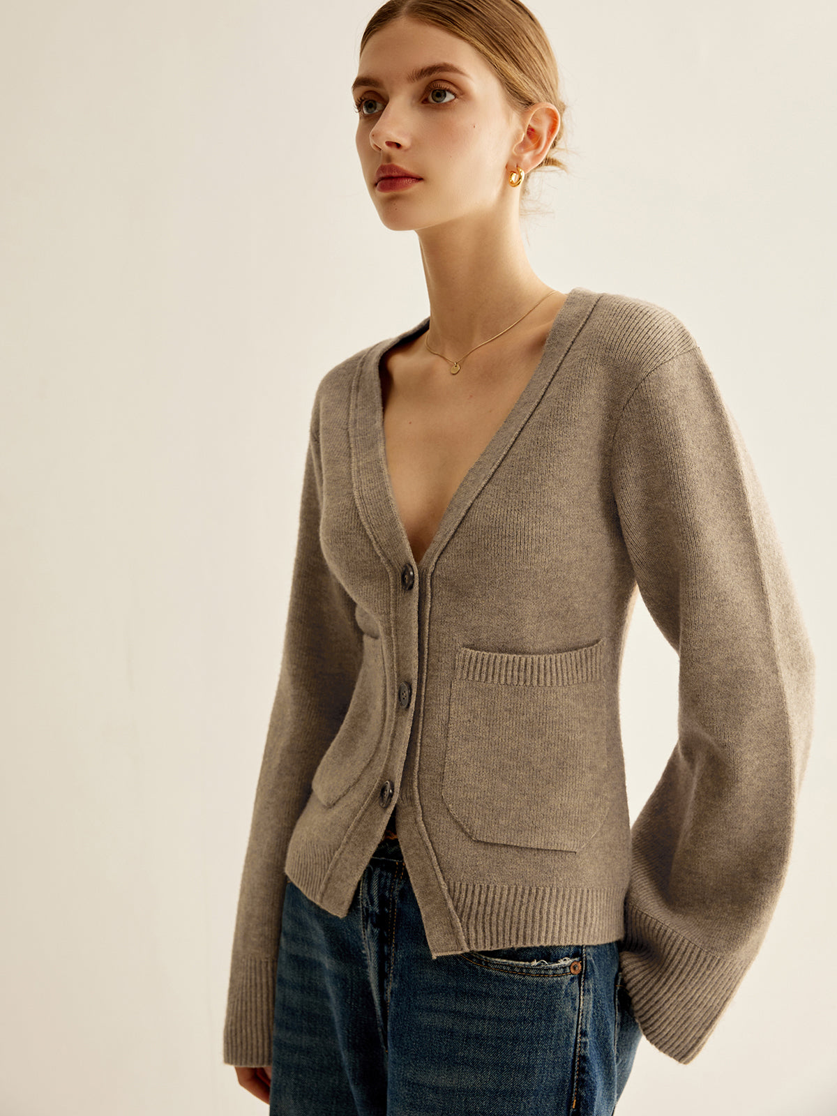 Women's fitted V-neck cardigan with flared sleeves and patch pockets