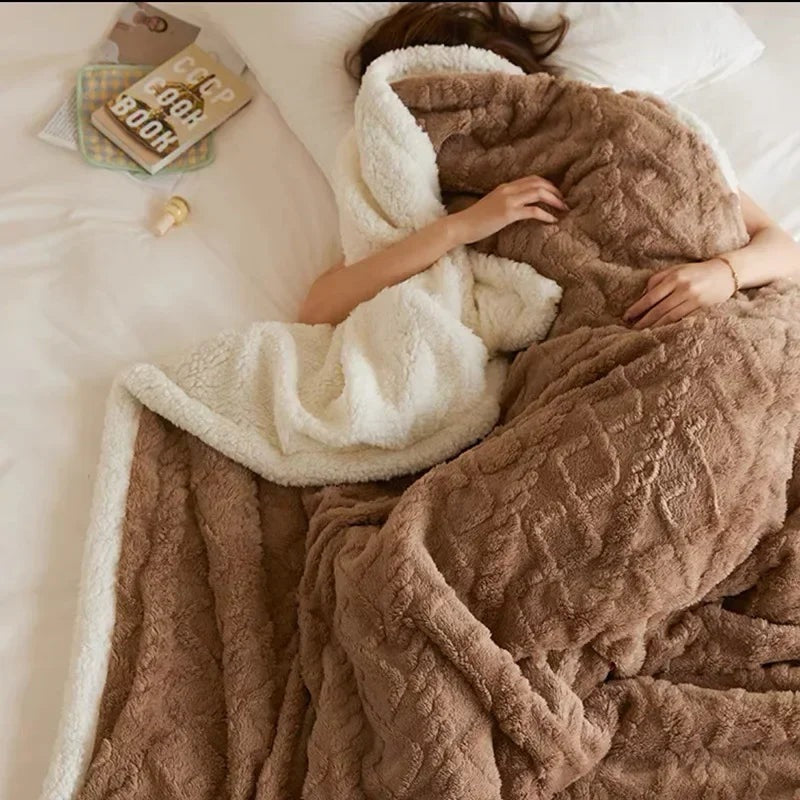 Fleece blanket with a sherpa reverse and an embossed pattern on a double bed - mocha brown