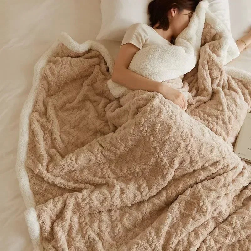 Fleece blanket with a sherpa reverse and an embossed pattern on a double bed - beige