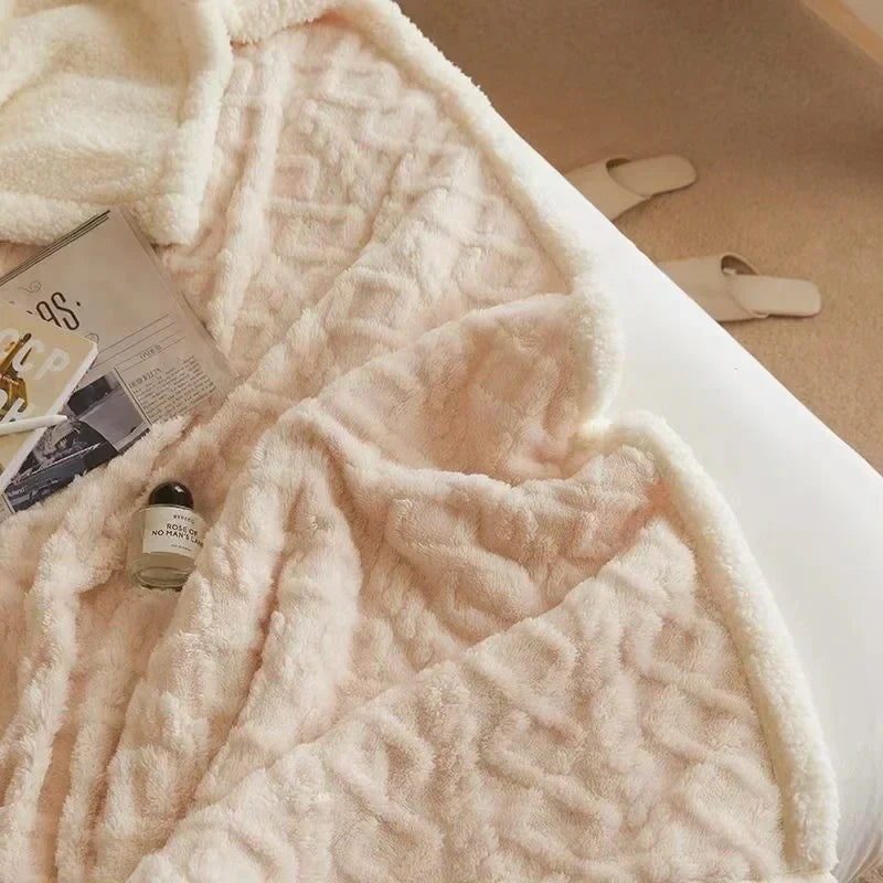 Fleece blanket with a sherpa reverse and an embossed pattern on a double bed - cream