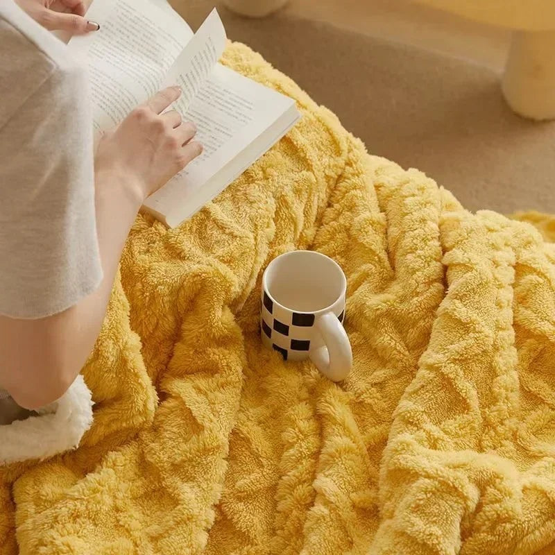 Fleece blanket with a sherpa reverse and an embossed pattern on a double bed - yellow