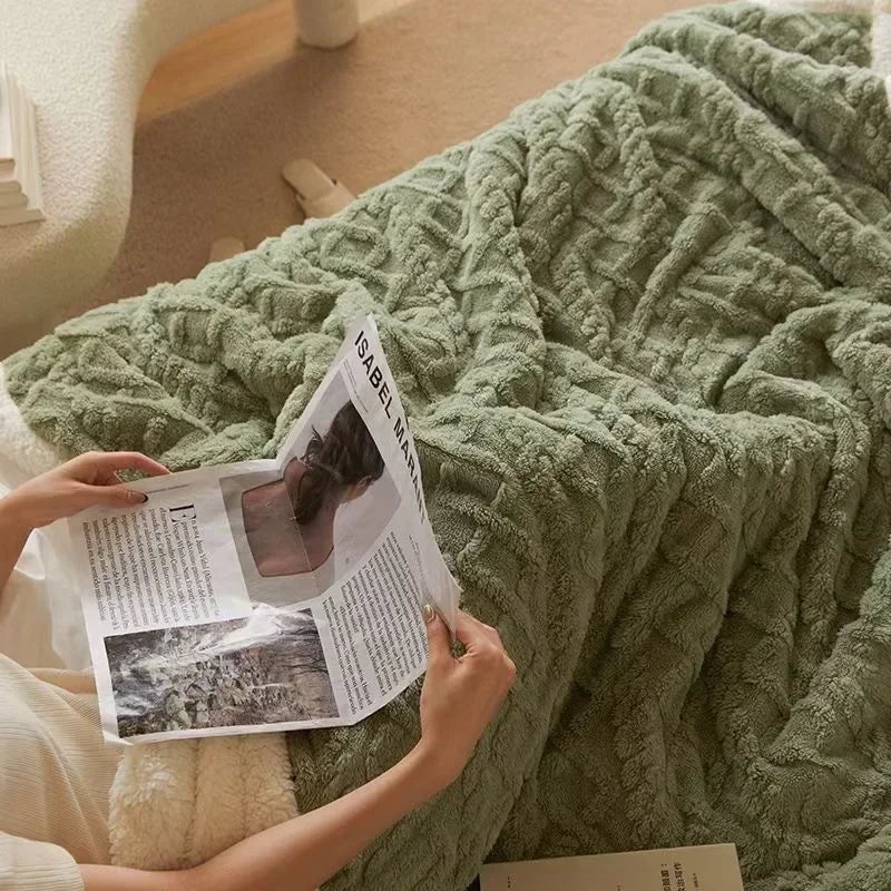 Fleece blanket with a sherpa reverse and an embossed pattern on a double bed - sage green
