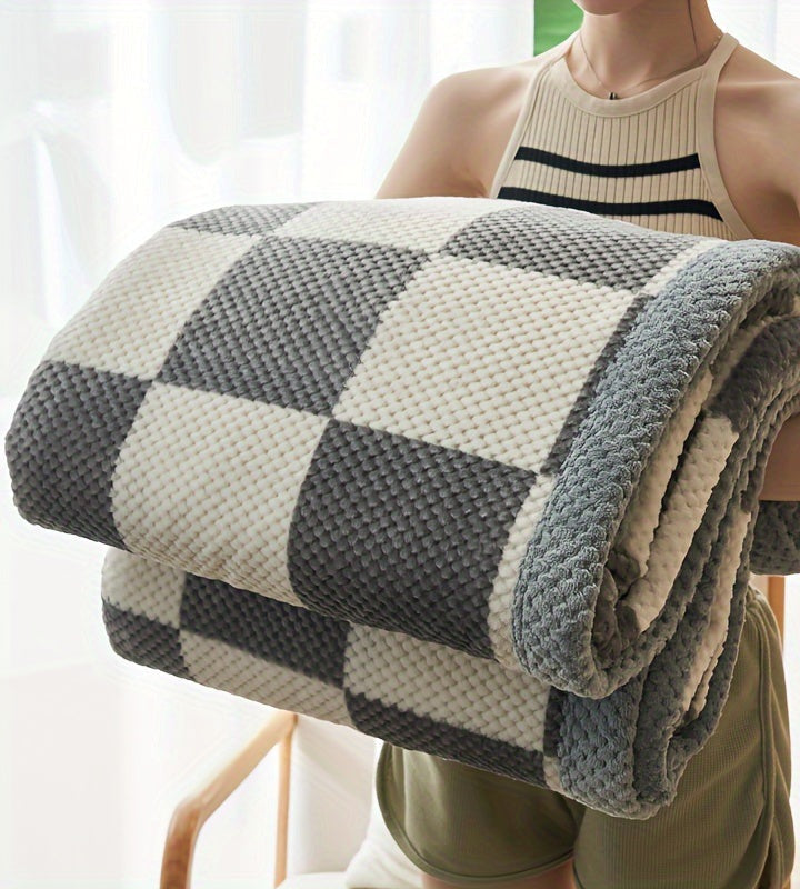 Fleece throw with a check pattern and waffle texture - grey block check