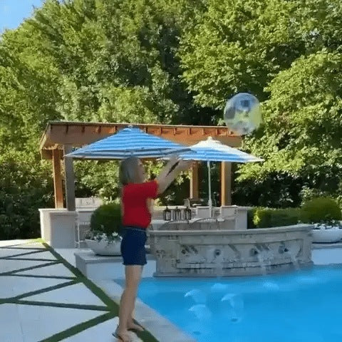 Floating solar light ball glowing in a swimming pool at night - view 6