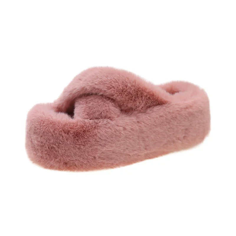 Slippers with crossed faux fur straps and a thick platform sole covered in plush - pink