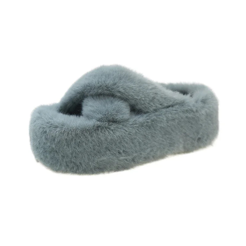 Slippers with crossed faux fur straps and a thick platform sole covered in plush - light blue