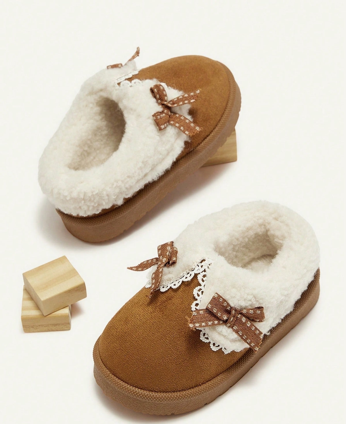 Slippers for girls with a thick plush collar, plush lining and a firm sole with tread - camel with bow