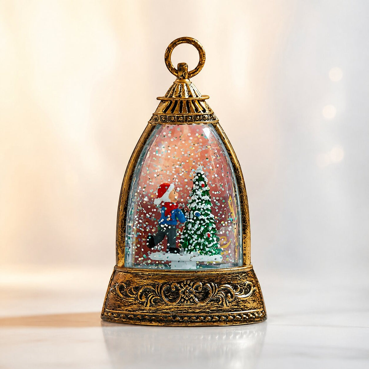 Light-up glitter lantern in a bell shape with a Christmas scene - skater by a christmas tree