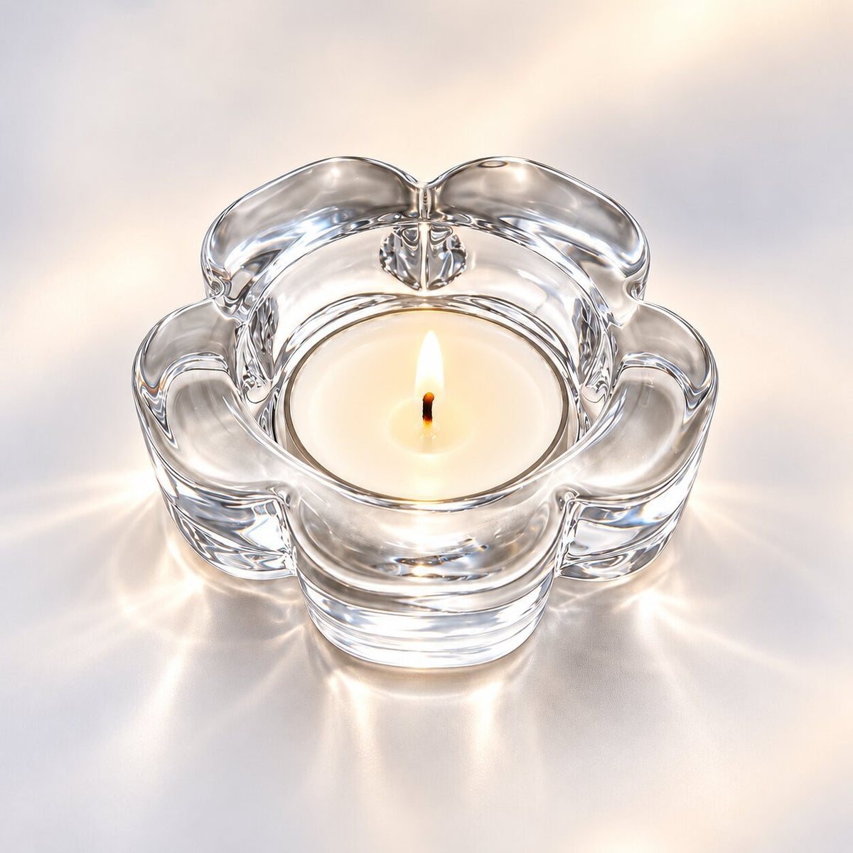 Handmade tea light holder in thick, clear glass - flower