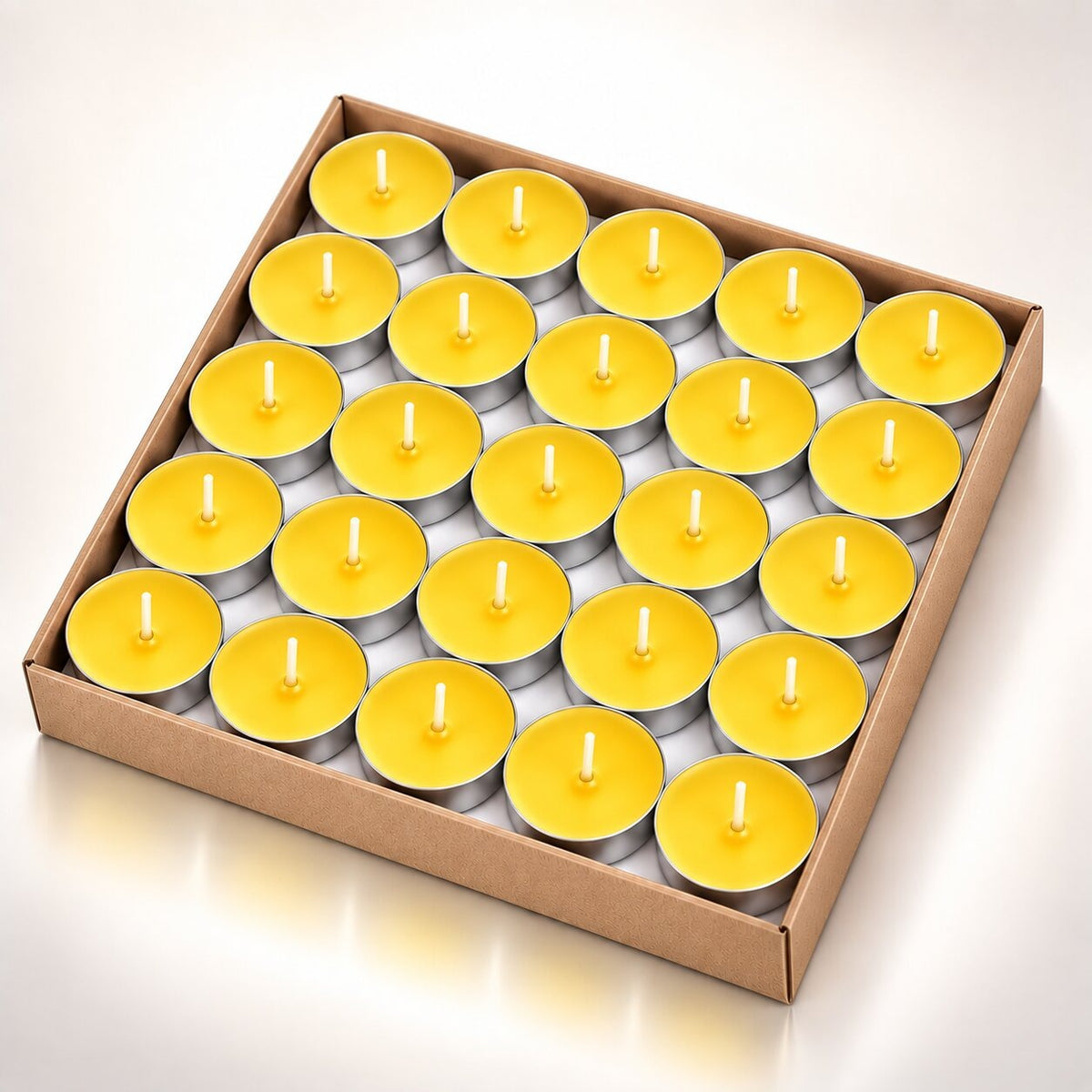 Coloured heart-shaped and round tea lights in cardboard boxes - yellow