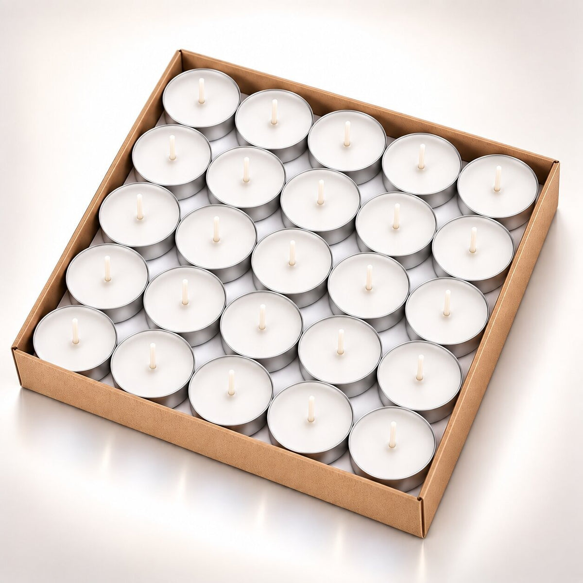 Coloured heart-shaped and round tea lights in cardboard boxes - white
