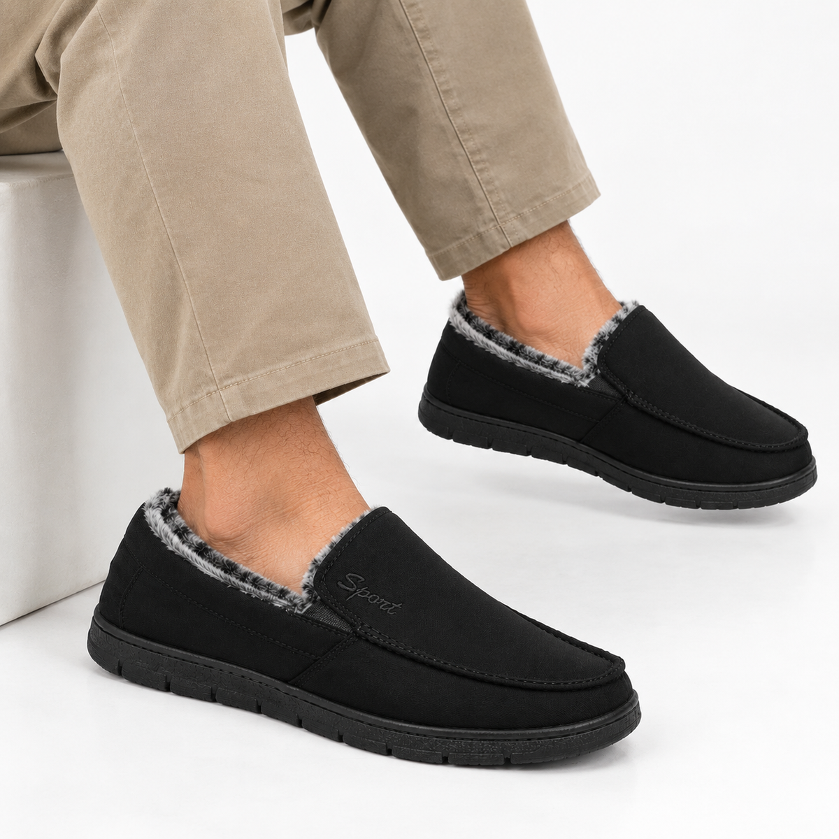 Fleece-lined slip-on loafers in black with a flat tread sole