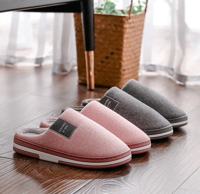 Slippers with a herringbone upper, open heel, plush lining and a white-striped sole