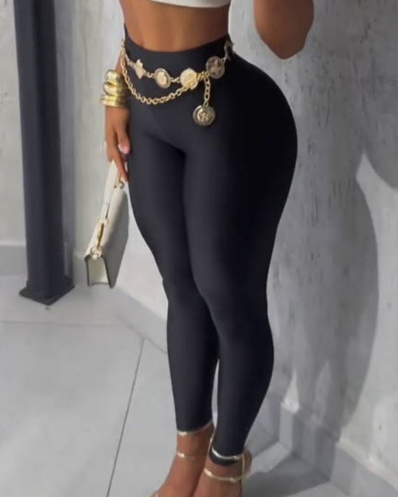 High-waisted shiny full-length leggings, seen from the front and side - black