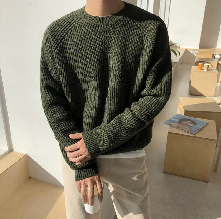 Oversized rib knit jumper worn loose over trousers