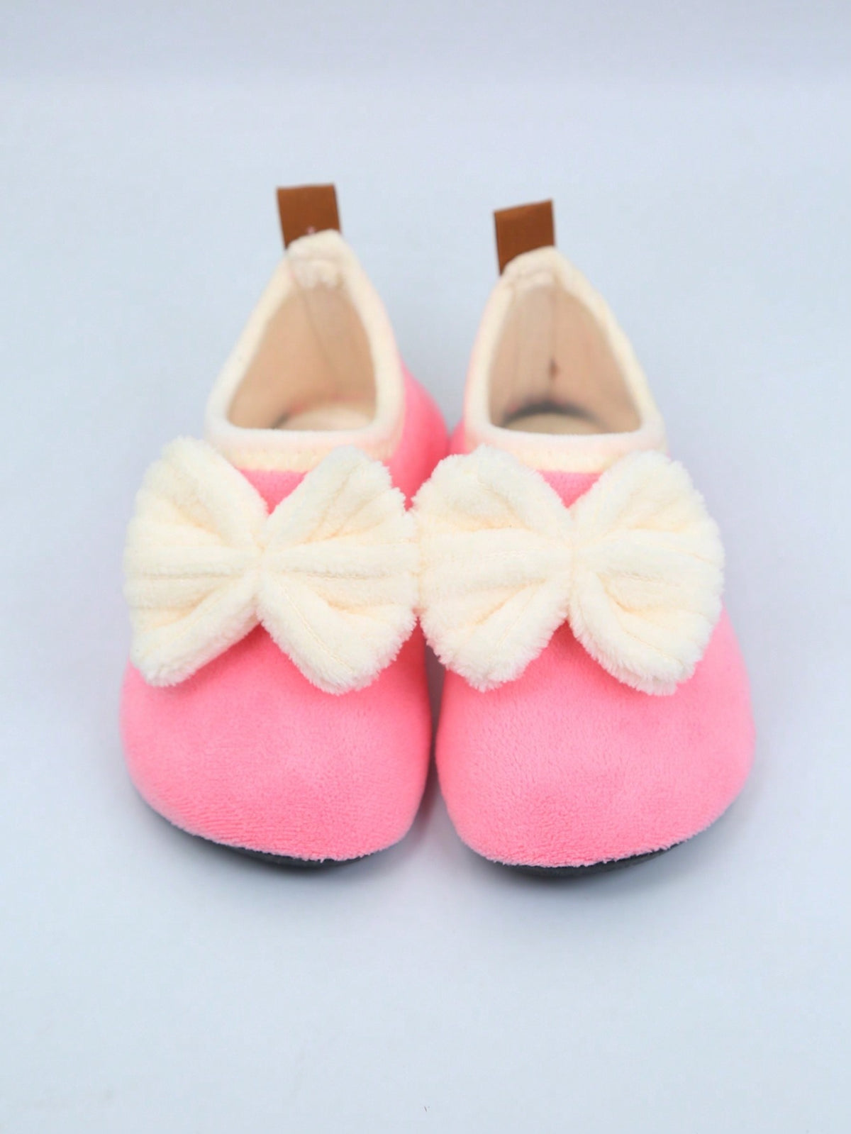 Slipper socks for kids with a soft lined upper, thin rubber sole and a pull-on loop at the heel - view 6