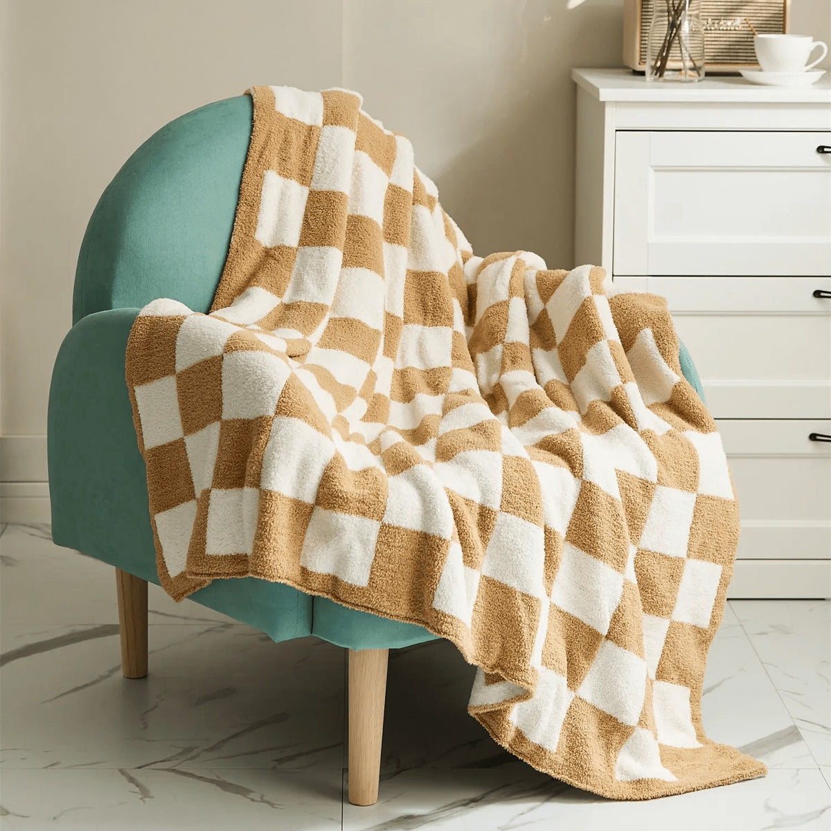 Knitted teddy throw with a checkerboard pattern over an armchair