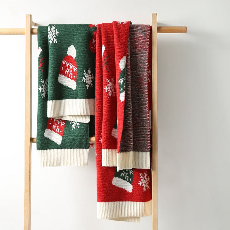 Knitted Christmas scarf with a knitted-in festive motif and ribbed ends