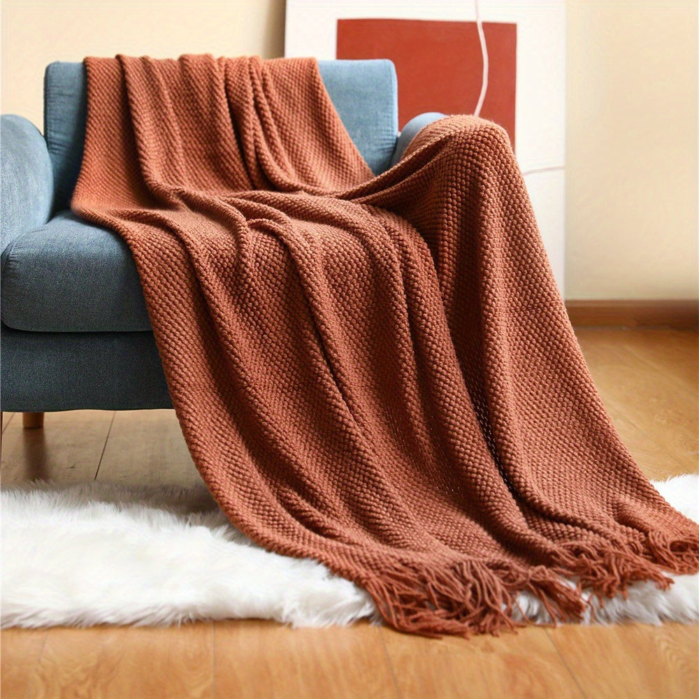 Knitted throw with a bobble texture and fringes - rust