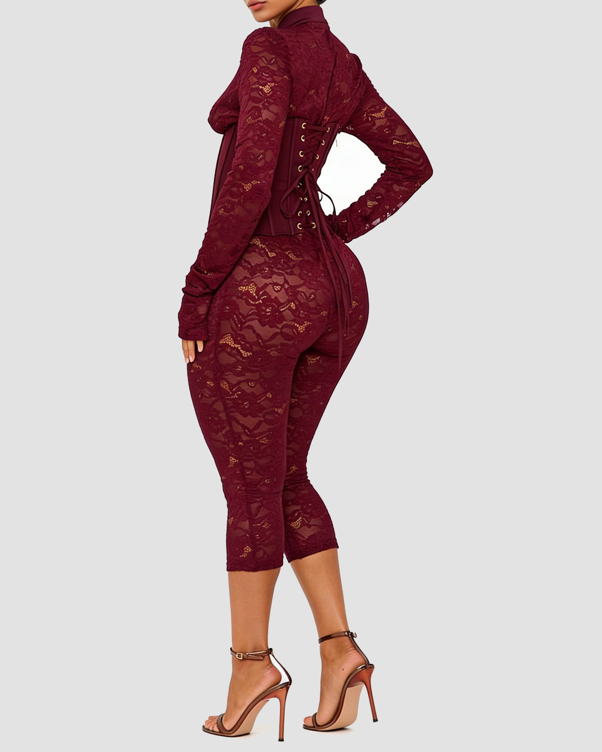 Lace jumpsuit with a high neck, boned corset bodice and calf-length legs