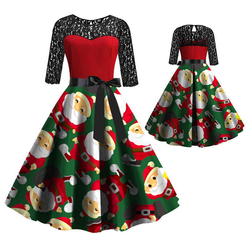 Women's Christmas dress with black lace sleeves, red bodice and Santa-print skirt