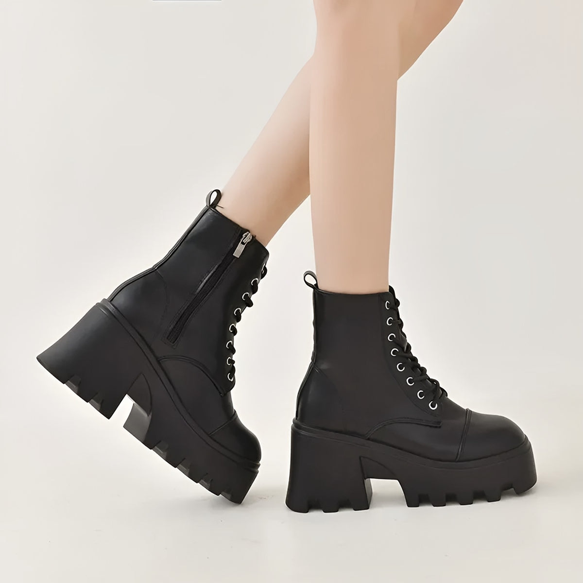 Black lace-up platform ankle boots with a block heel, side view with zip