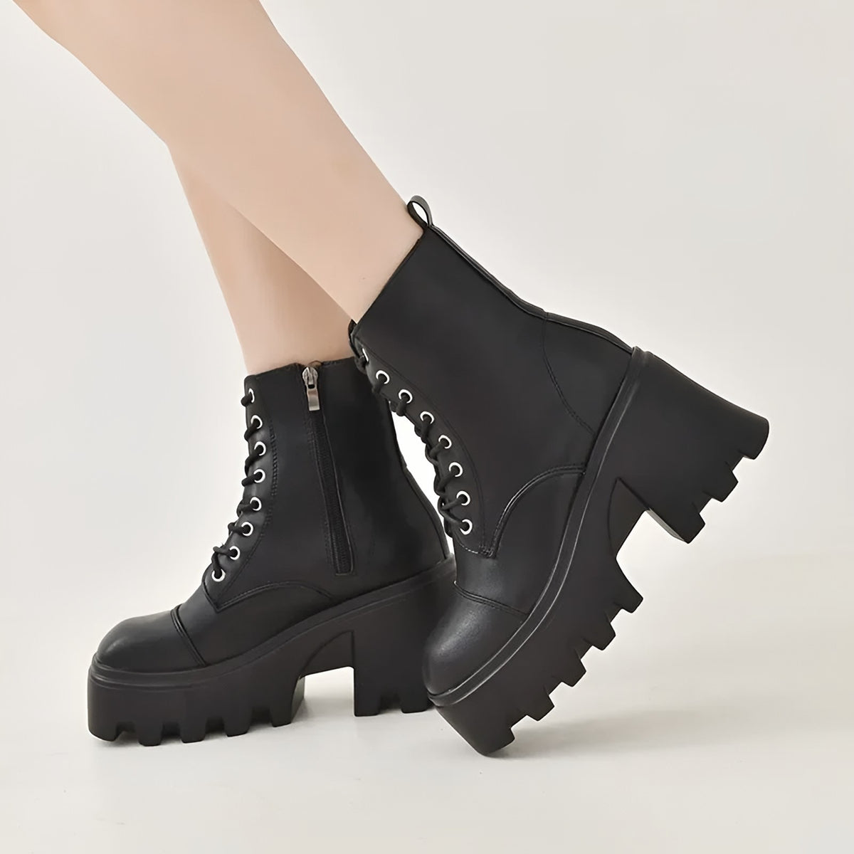 Black ankle boot with a side zip and a wide block heel