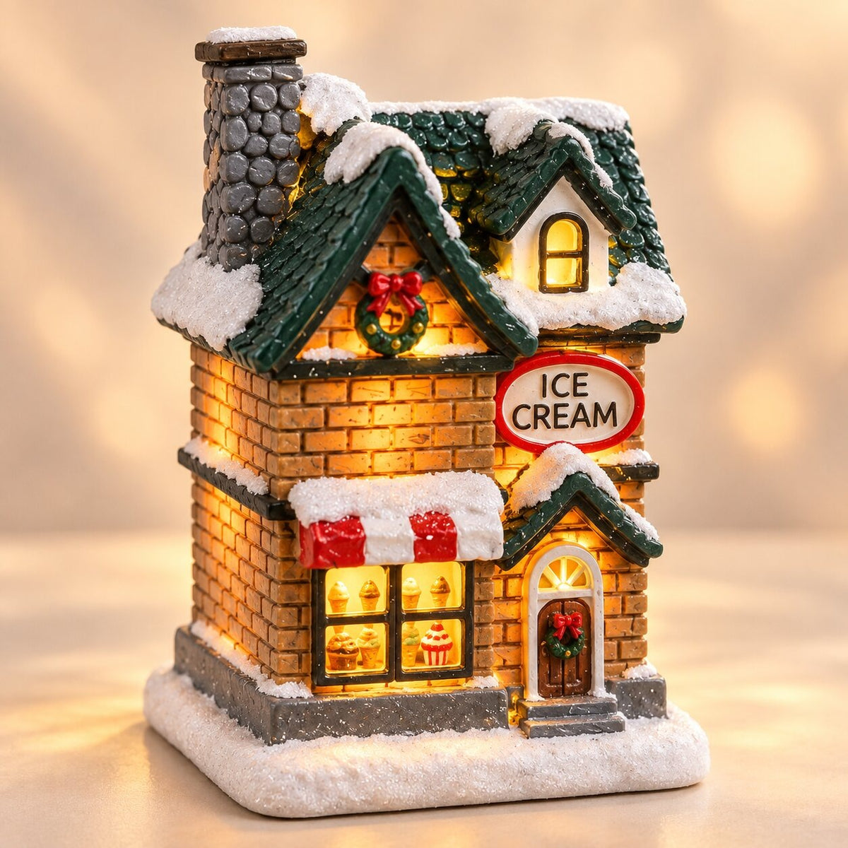 Light-up Christmas house with snow on the roof - ice cream parlour