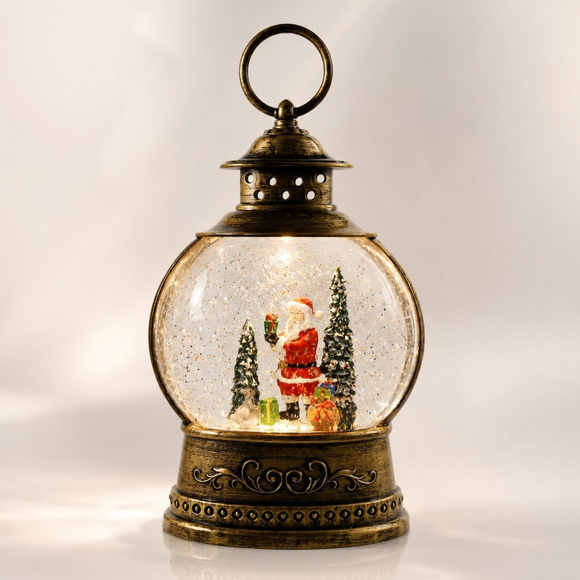 Light-up snow globe lantern in antique bronze with a Christmas scene - santa with presents