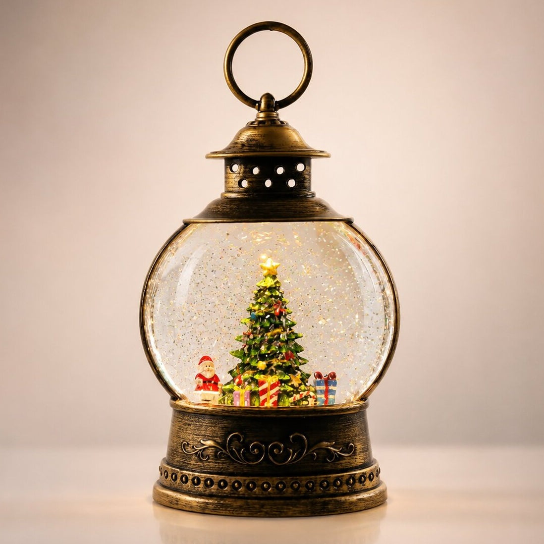 Light-up snow globe lantern in antique bronze with a Christmas scene - christmas tree
