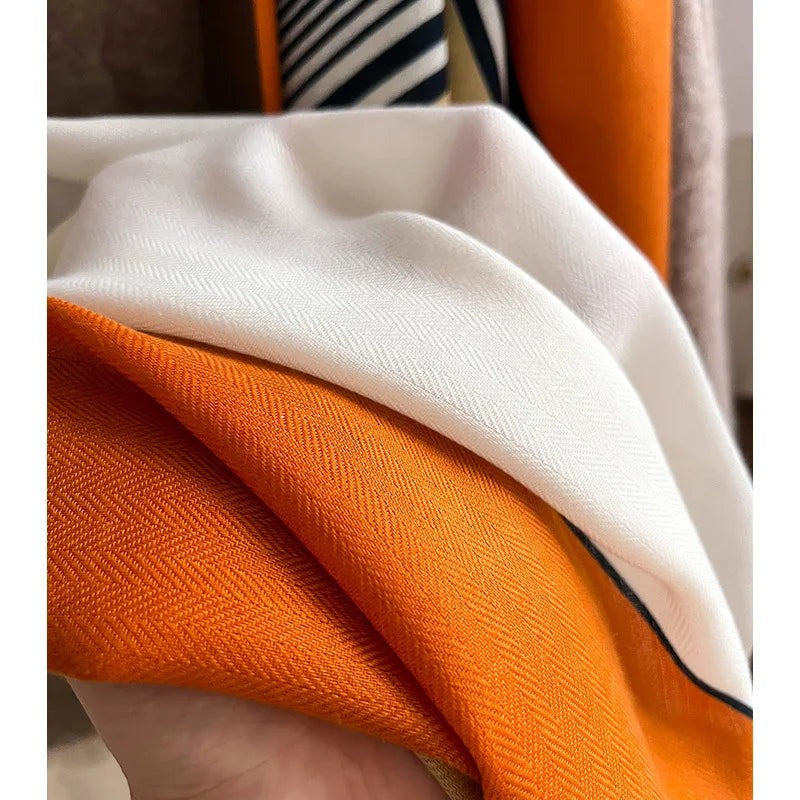 Women's lightweight scarf with a graphic print of blocks and stripes and a narrow contrast border