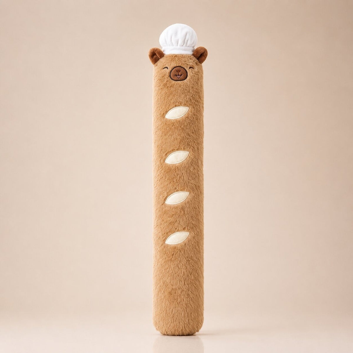 Long 3 litre capybara hot water bottle with a plush cover and chef's hat - light brown leaves