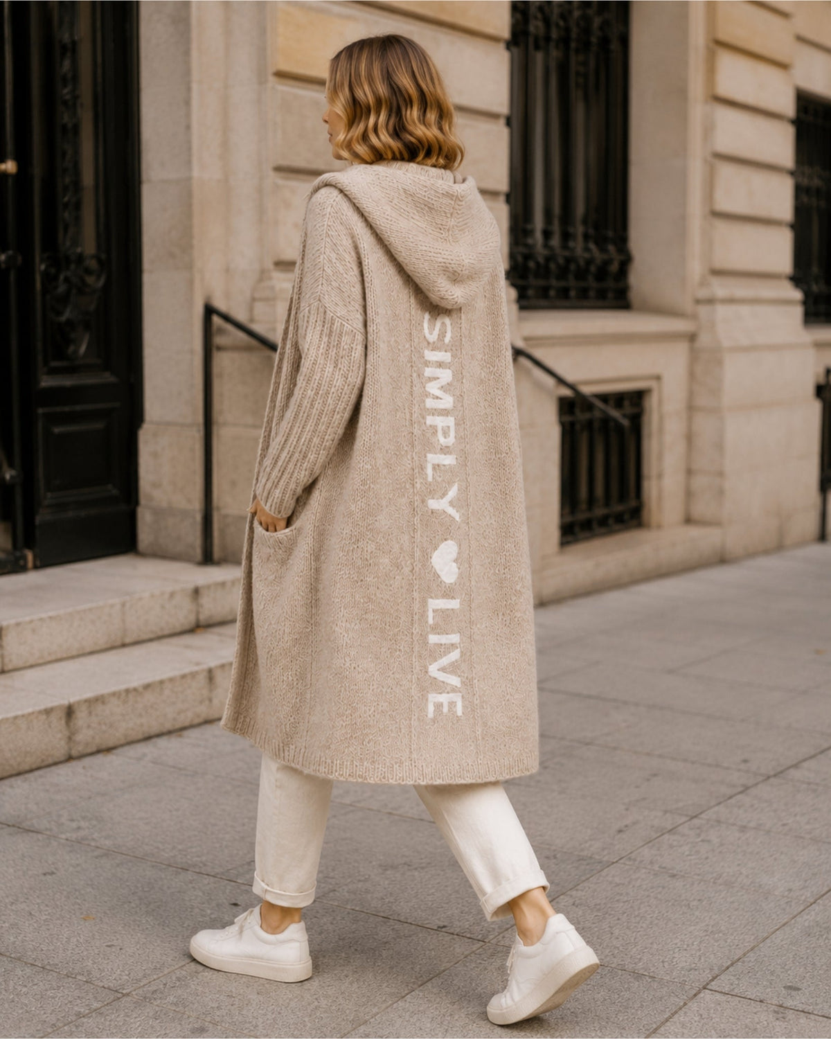 Women's longline hooded cardigan with an open front and patch pockets