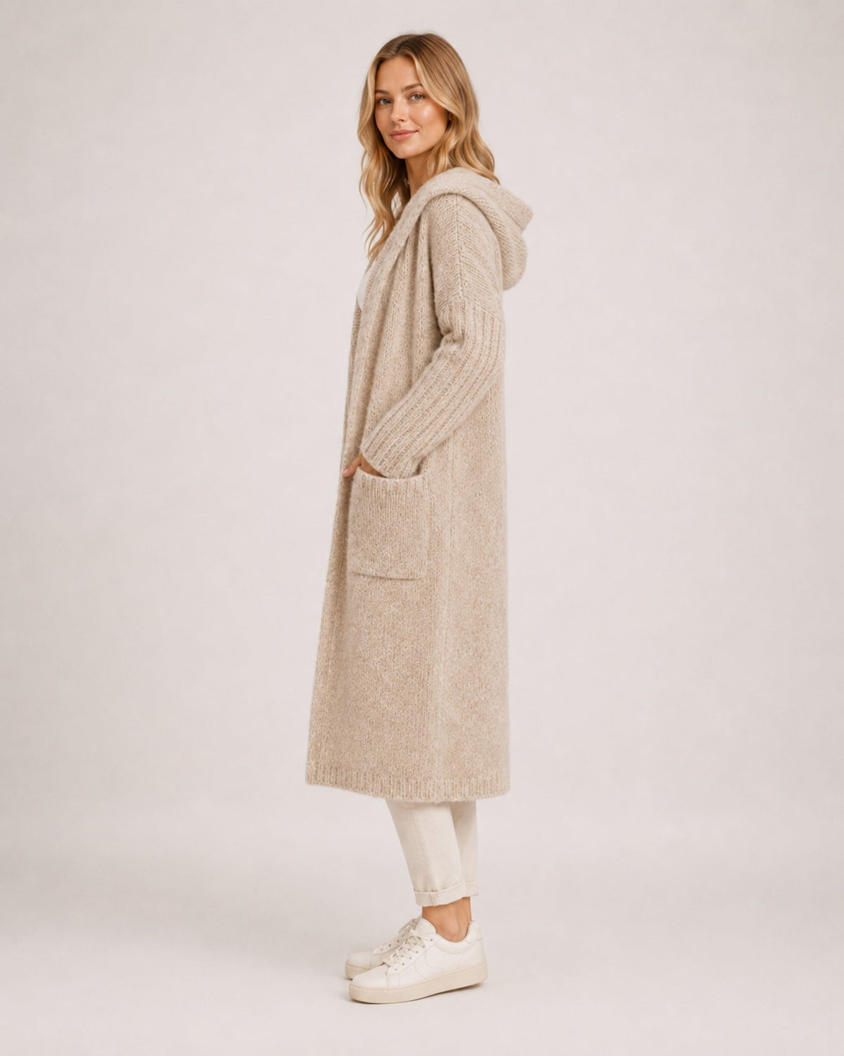 Women's longline hooded cardigan with an open front and patch pockets