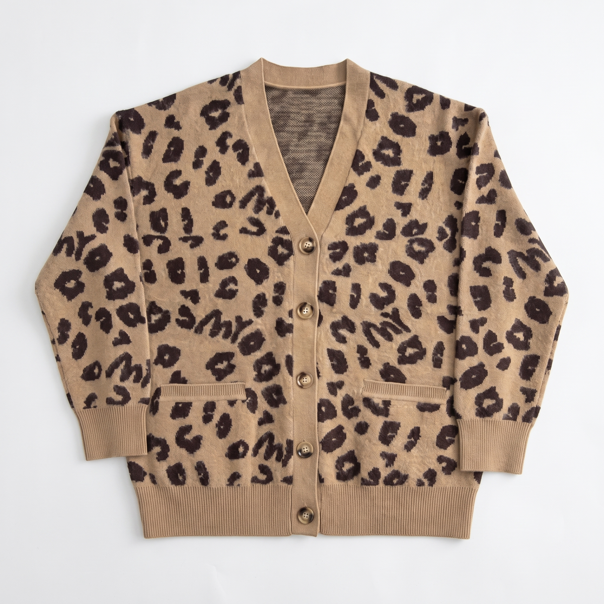 Women's longline leopard knit cardigan with a V-neck and patch pockets