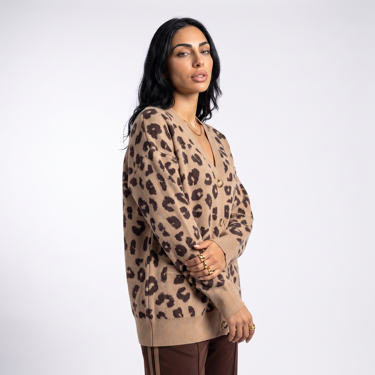 Women's longline leopard knit cardigan with a V-neck and patch pockets