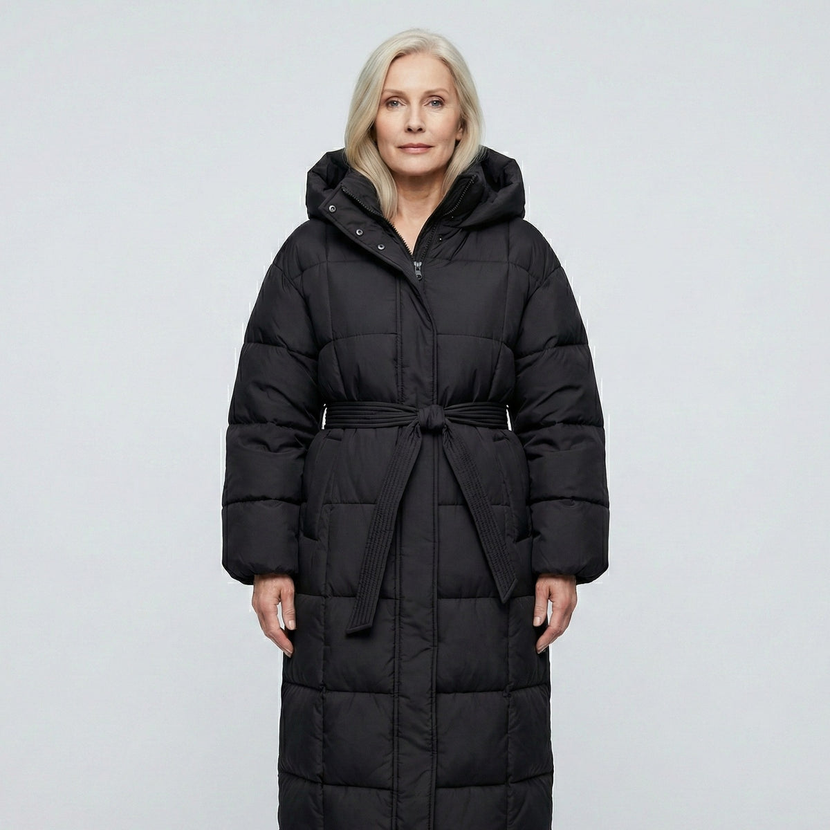 Women's longline puffer coat with a hood and tie belt - black