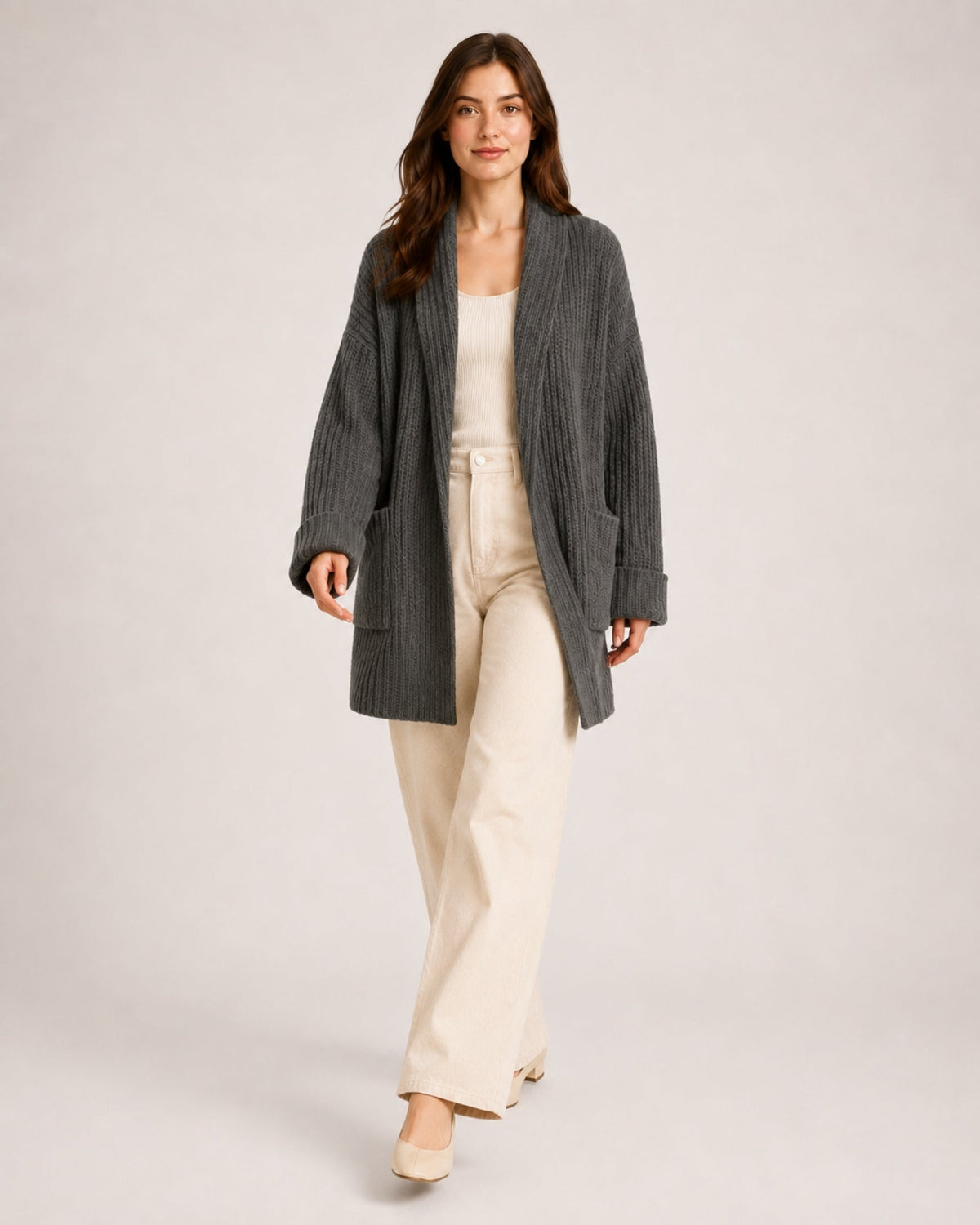 Women's longline ribbed cardigan with a shawl collar and patch pockets