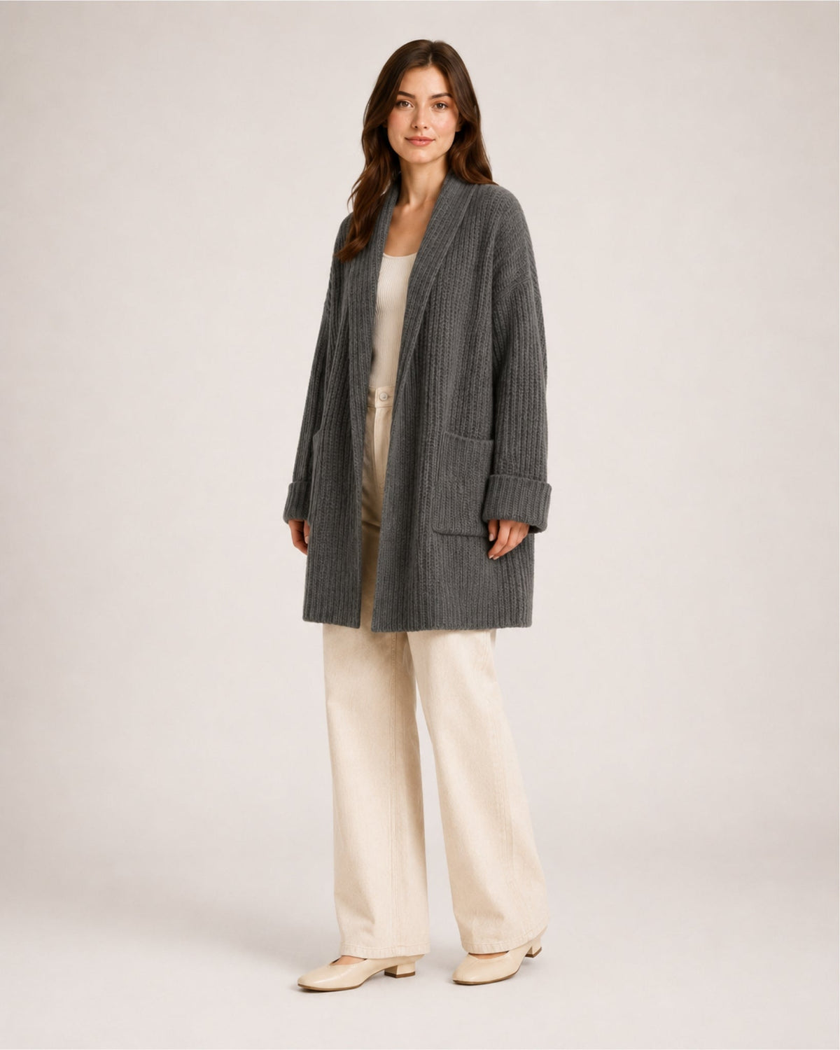 Women's longline ribbed cardigan with a shawl collar and patch pockets