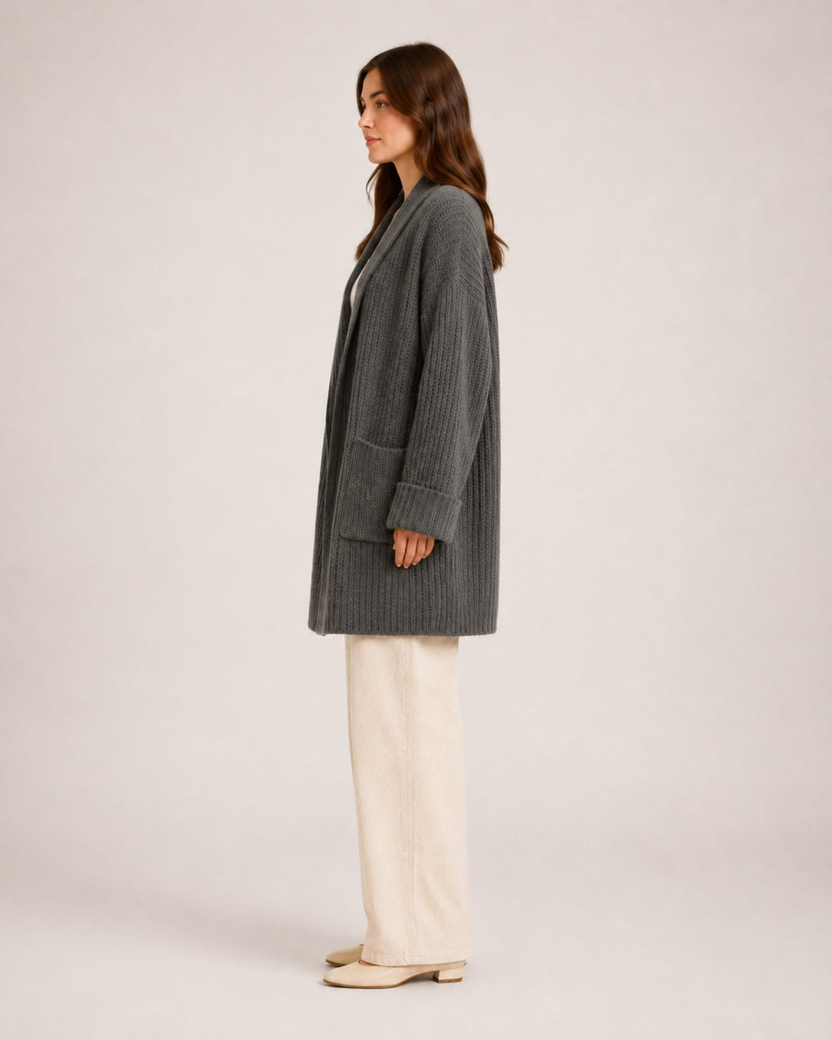Women's longline ribbed cardigan with a shawl collar and patch pockets