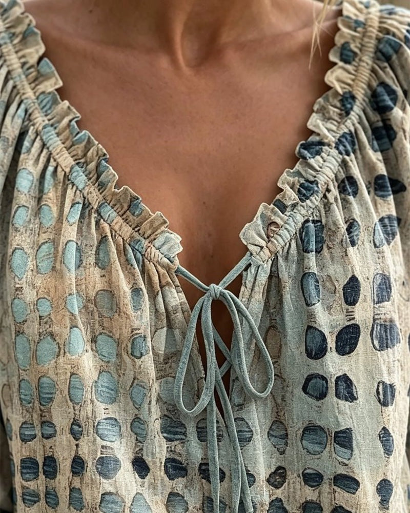 Loose polka dot blouse with a ruffled V-neck and tie cord - view 2