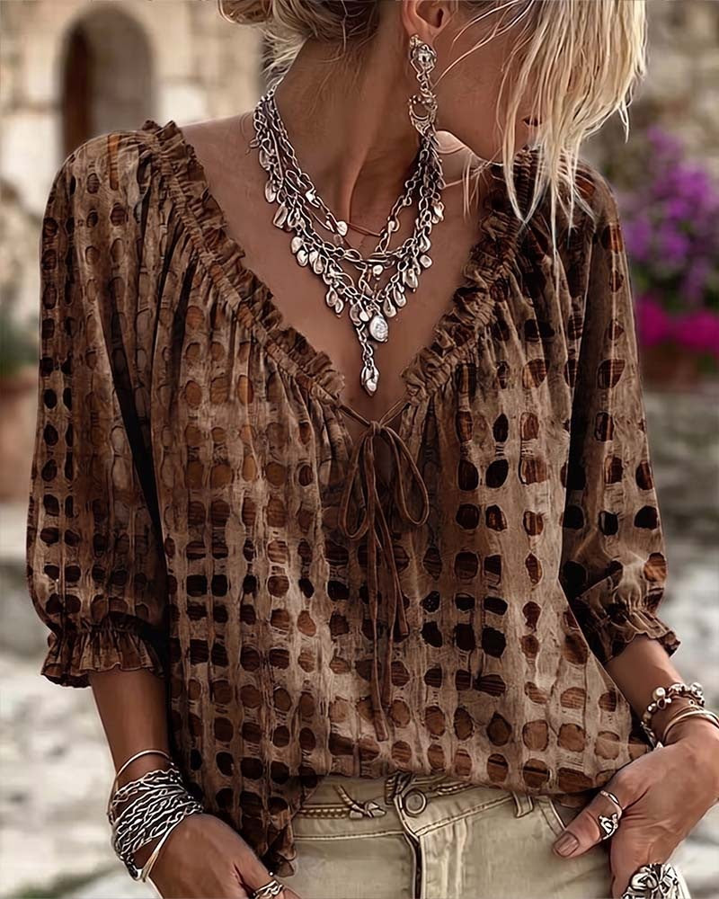 Loose polka dot blouse with a ruffled V-neck and tie cord - brown