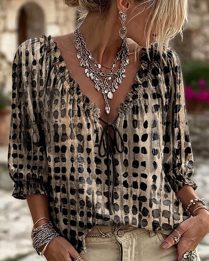 Loose polka dot blouse with a ruffled V-neck and tie cord - taupe and black
