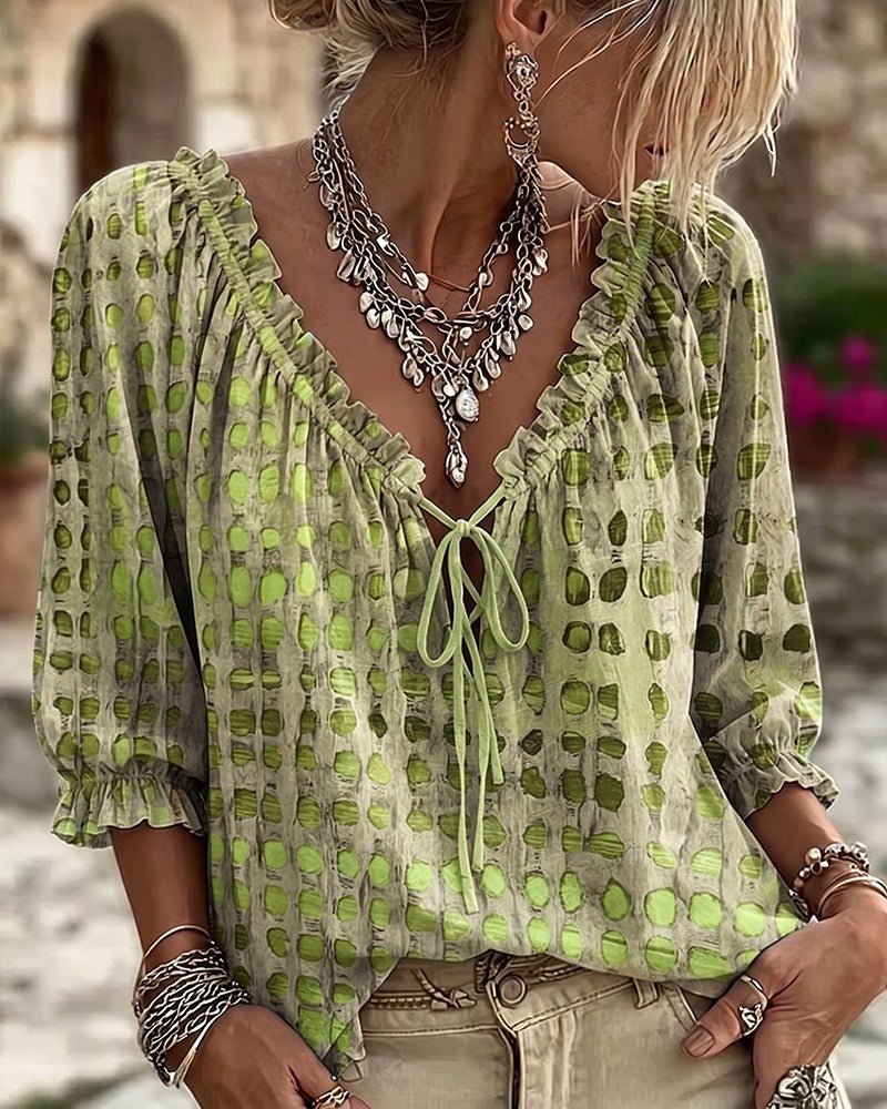Loose polka dot blouse with a ruffled V-neck and tie cord - lime green
