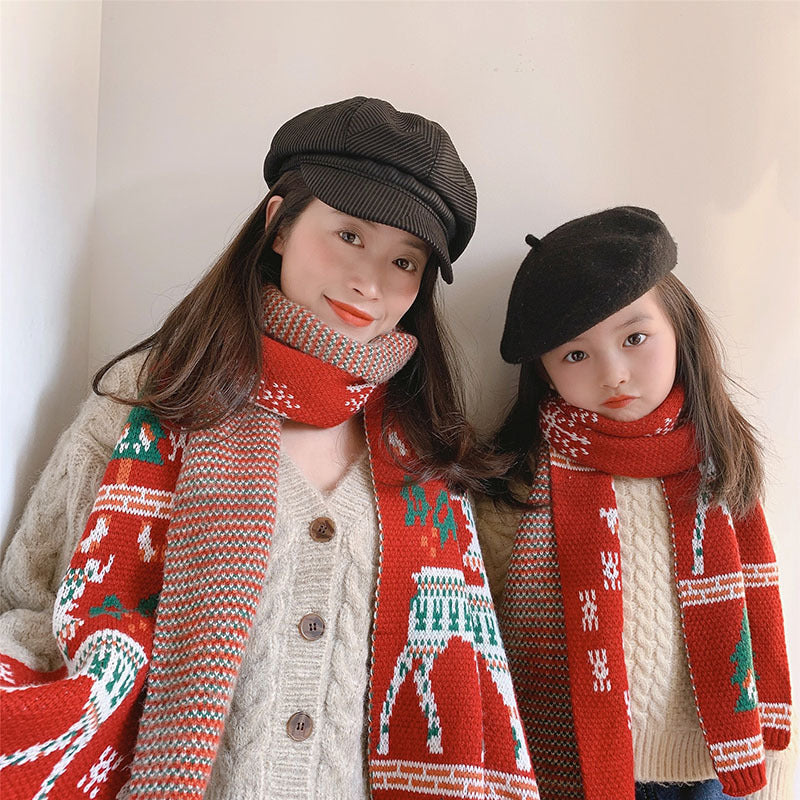 Red knitted Christmas scarf with a reindeer and trees, for parent and child
