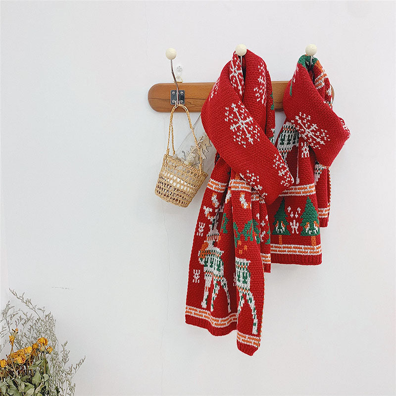 Red knitted Christmas scarf with a reindeer and trees, for parent and child