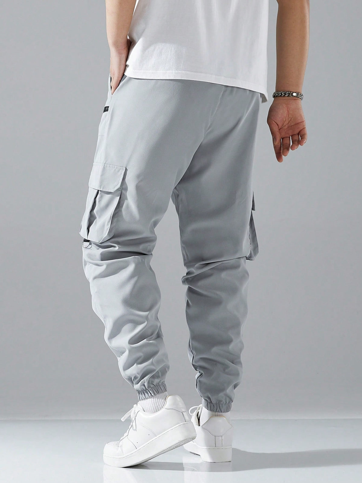 Cargo joggers for men with a drawcord waist, zip pockets, thigh flap pockets and cuffed ankles - light grey