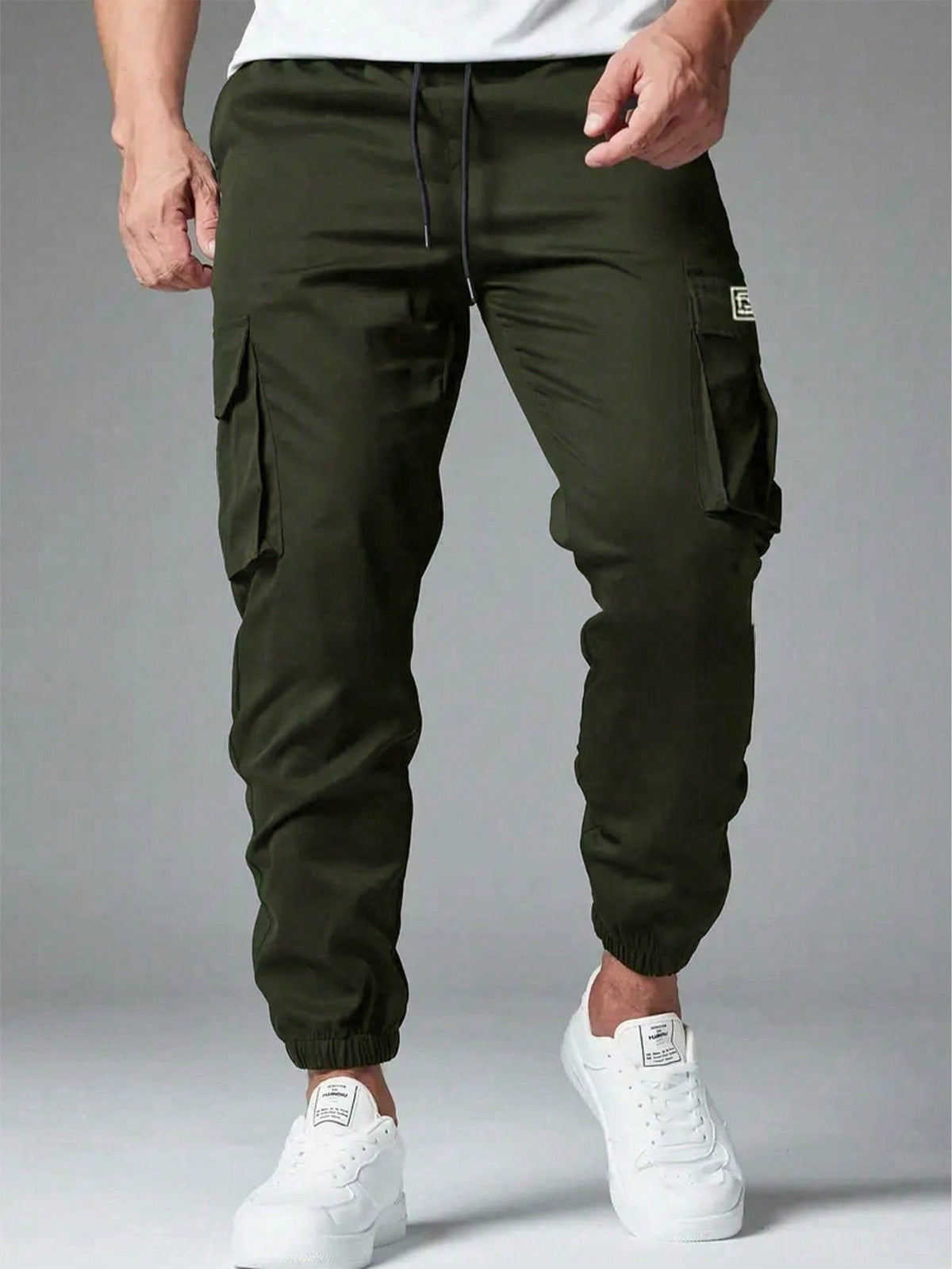 Cargo trousers for men with a drawcord waist, thigh flap pockets and elastic cuffs at the ankle - olive